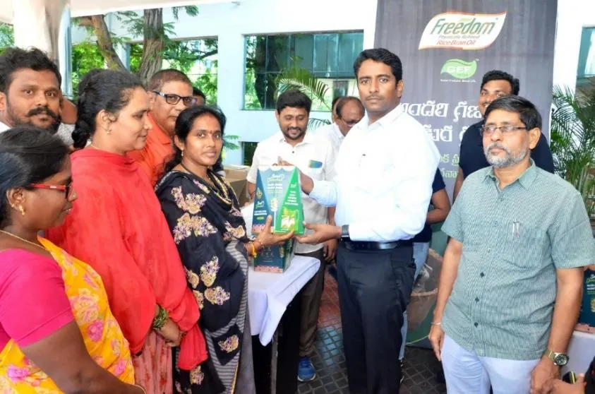 Residents collecting Seed Ganesha kits at a distribution counter