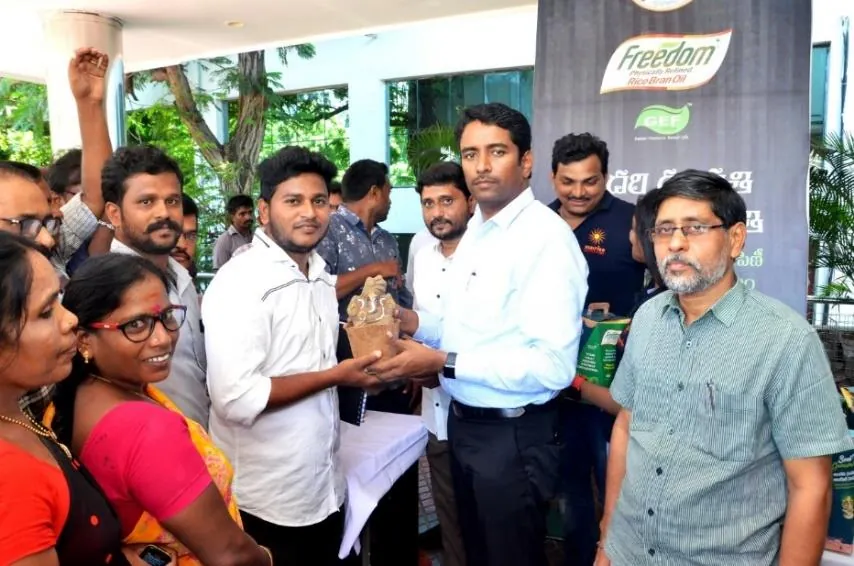 Community members receiving eco-friendly Ganesha idols